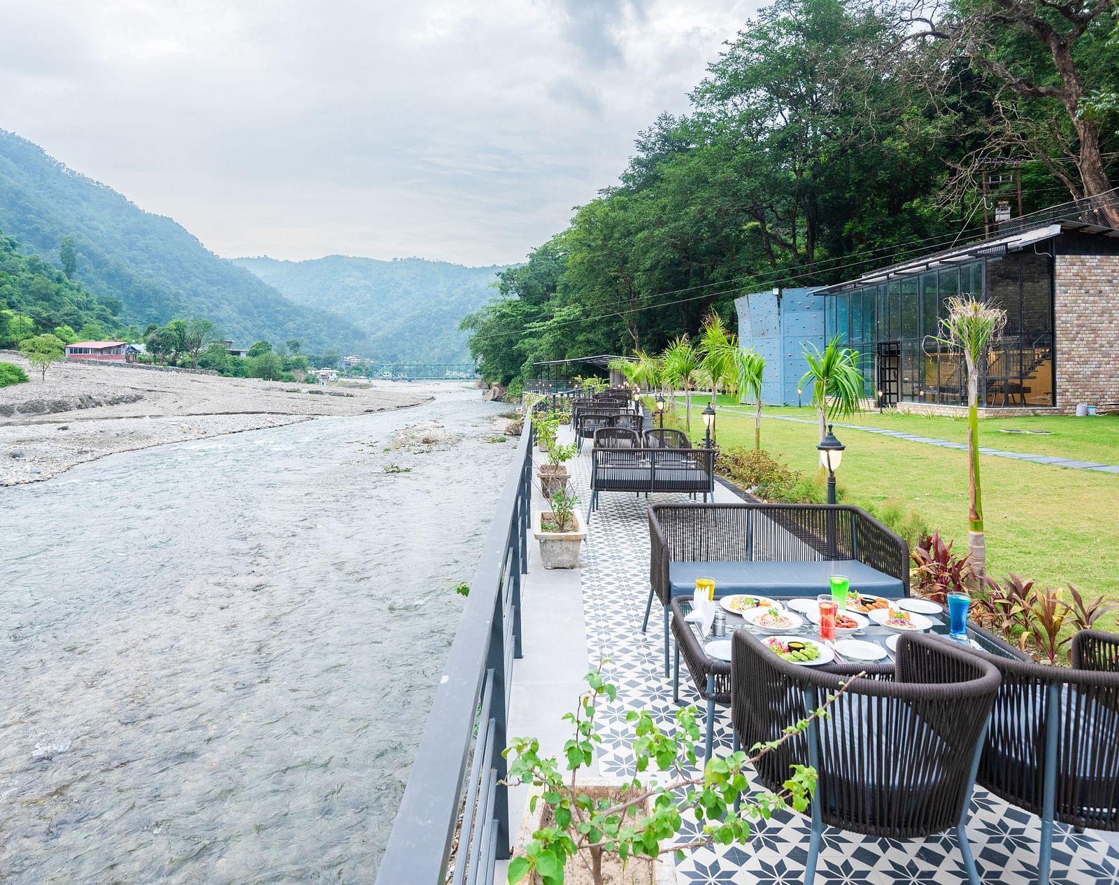 Restaurant dining area at DLS Divine River Resort and Spa featuring stunning views o f the river